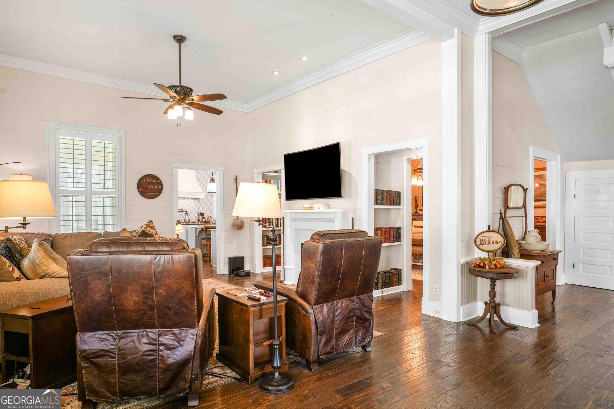193 Bartee Road Woodbury, GA 30293 - Photo 10 of 84 a living room with furniture and a flat screen tv