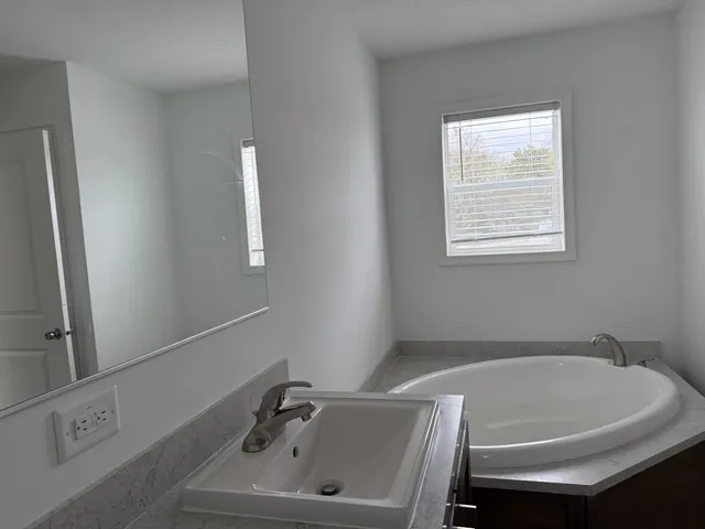 a bathroom with a sink and a bathtub