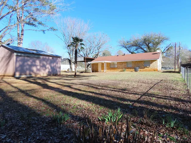 a view of a yard with an outdoor space