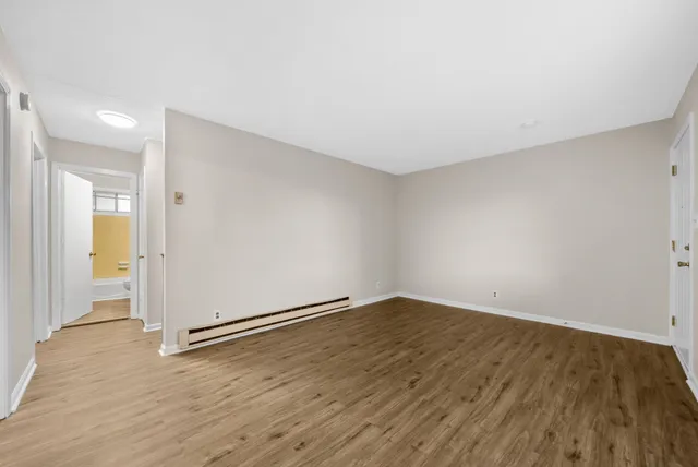 a view of a bathroom with a tub and shower