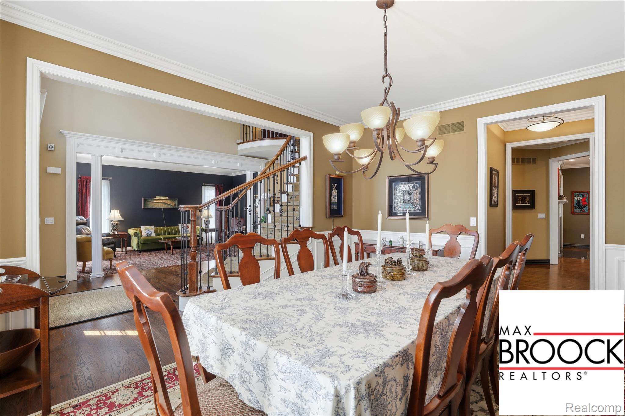 668 Springview Drive Rochester, MI 48307 - Photo 20 of 90 Dining area featuring hardwood / wood-style floors, crown molding, and a chandelier