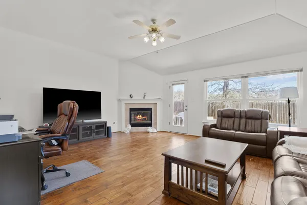 a living room with furniture and a fireplace