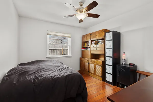 a bedroom with a bed and a television