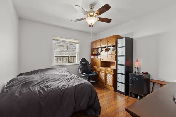 a bed room with a bed and a window