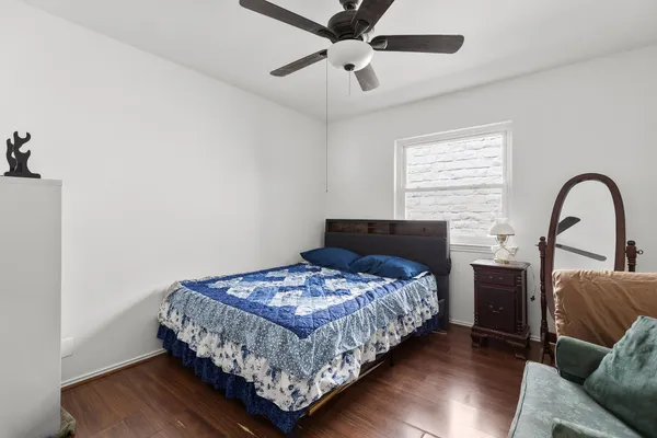 a bedroom with bed and a window