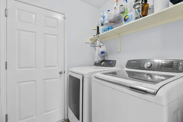 a utility room with dryer and washer
