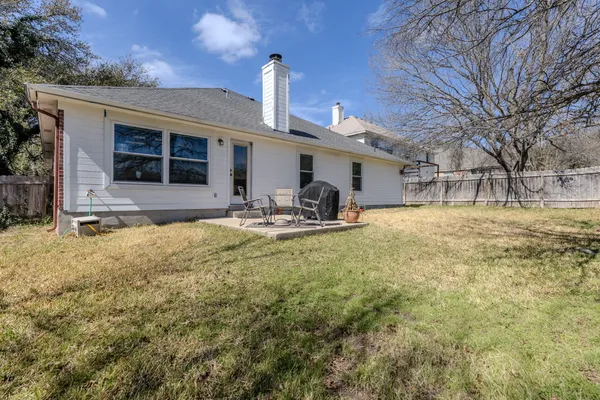 a house view with swimming pool and garden space