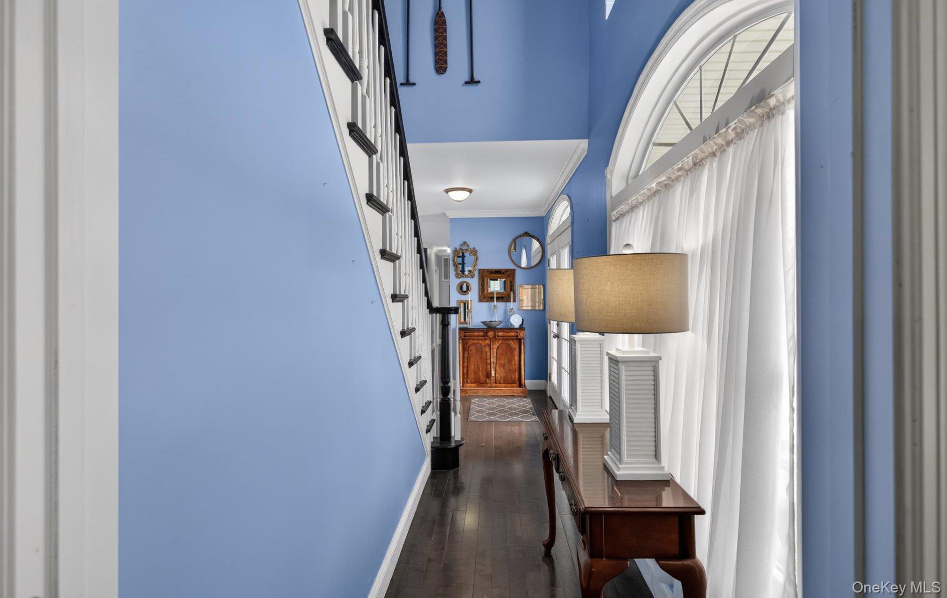 108 Awixa Avenue Bay Shore, NY 11706 - Photo 23 of 47 Corridor with dark wood-type flooring and crown molding