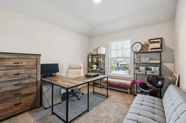 a bedroom with furniture and a window