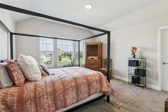 a bedroom with a bed and a cabinets