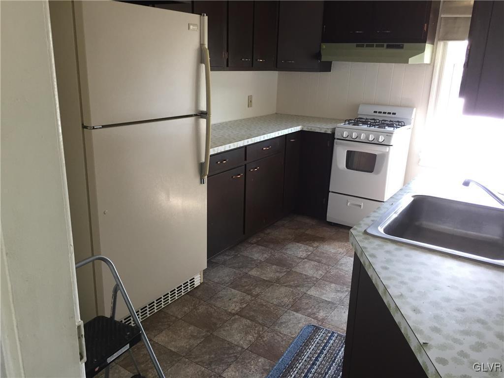 1403 Center Street Bethlehem, PA 18018 - Photo 14 of 25 a kitchen with a refrigerator sink and stove