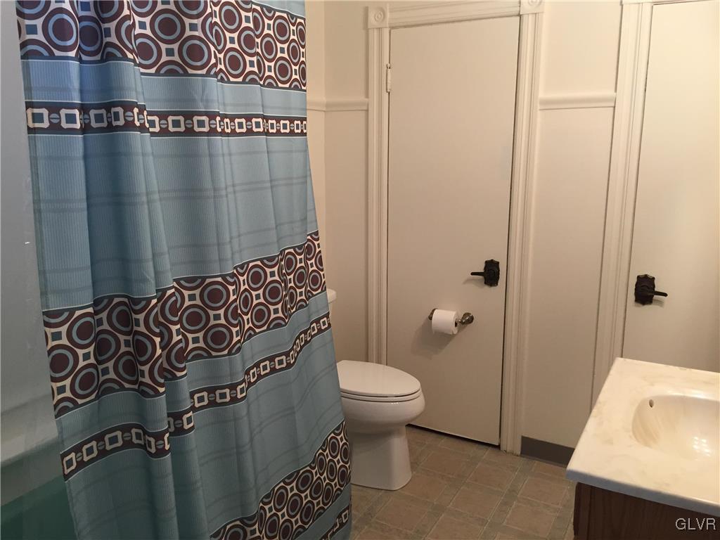1403 Center Street Bethlehem, PA 18018 - Photo 17 of 25 a bathroom with a toilet and shower