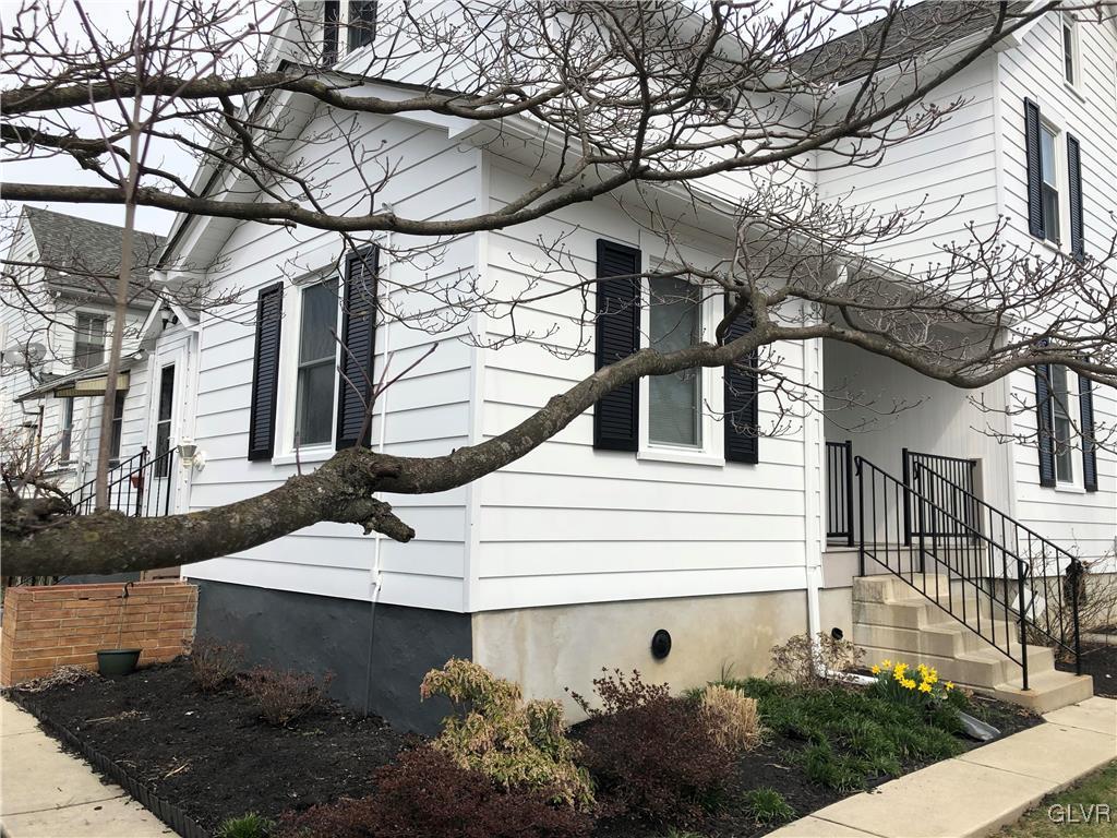 1403 Center Street Bethlehem, PA 18018 - Photo 3 of 25 a view of a house with a snow on a tree
