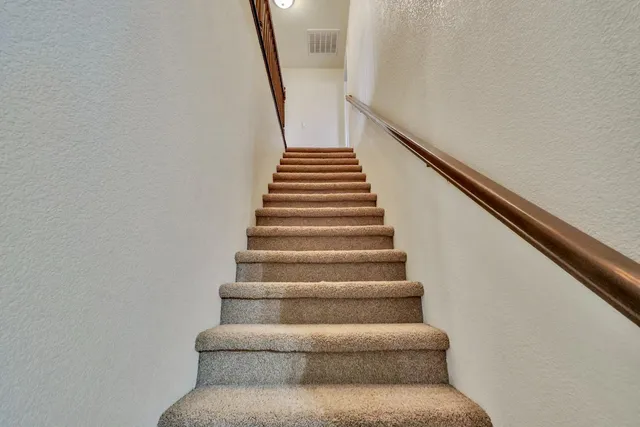 a bed room with a bed and a chandelier