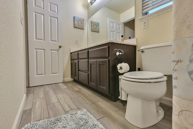 a view of a hallway with a staircase