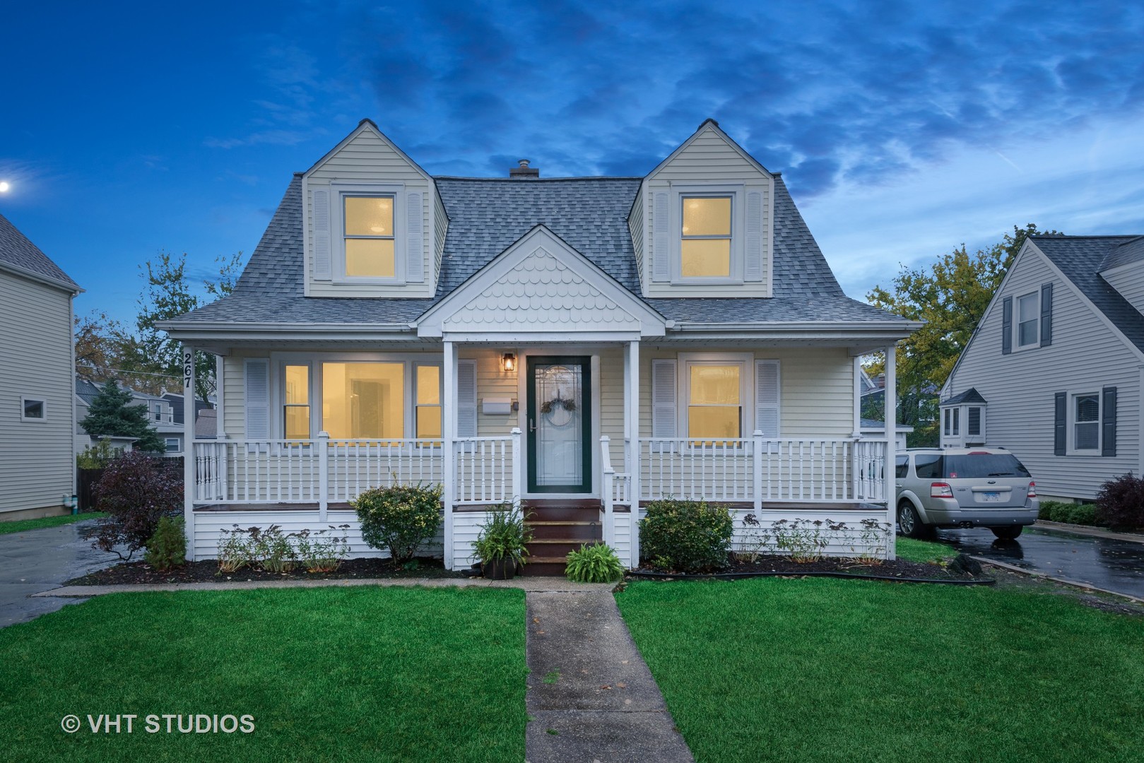267 West Butterfield Road Elmhurst, IL 60126 - Photo 1 of 29 a front view of a house with a garden
