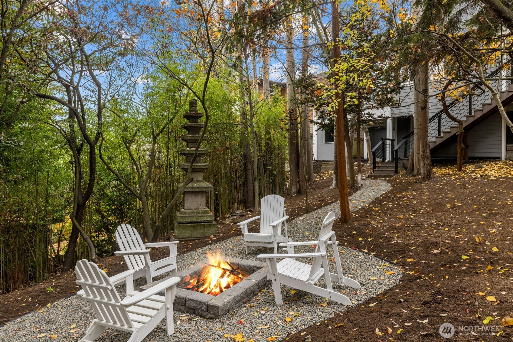 a view of a patio with table and chairs and potted plants