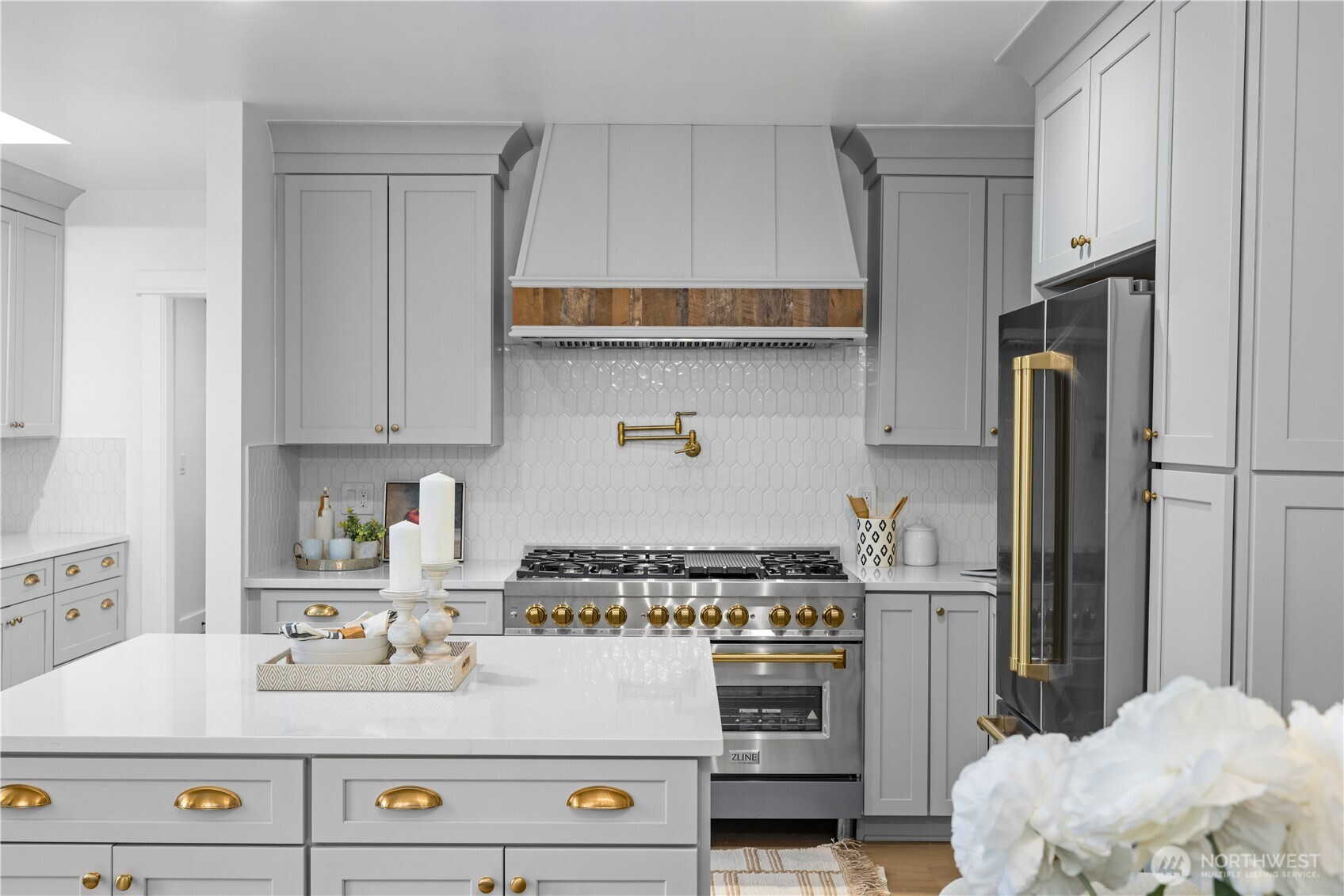 1014 4th Avenue North Seattle, WA 98109 - Photo 12 of 40 a kitchen with kitchen island a sink stove and refrigerator