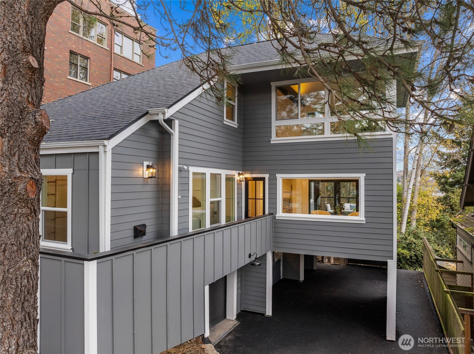 1014 4th Avenue North Seattle, WA 98109 - Photo 3 of 40 a view of a house with a yard and balcony