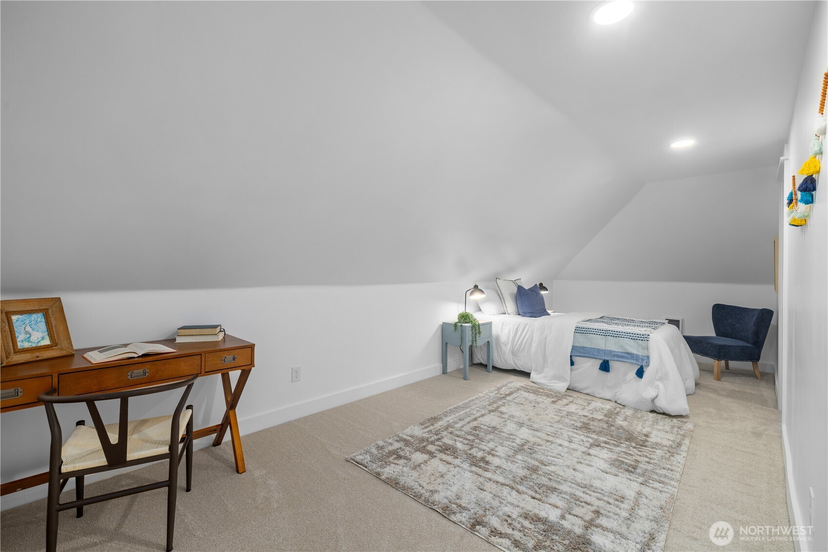 1014 4th Avenue North Seattle, WA 98109 - Photo 32 of 40 a bedroom with a bed and a table in it