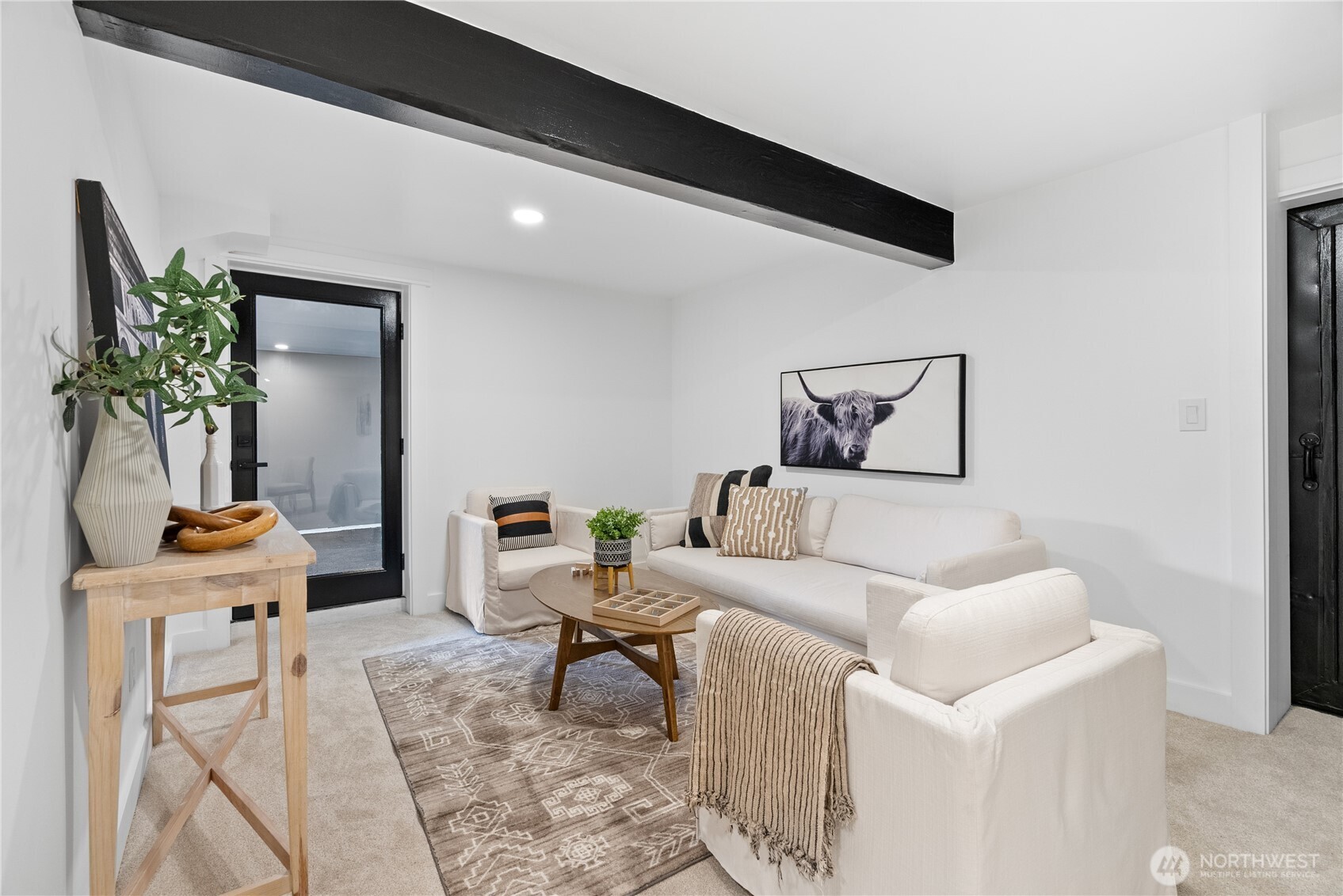 1014 4th Avenue North Seattle, WA 98109 - Photo 35 of 40 a living room with furniture and a potted plant