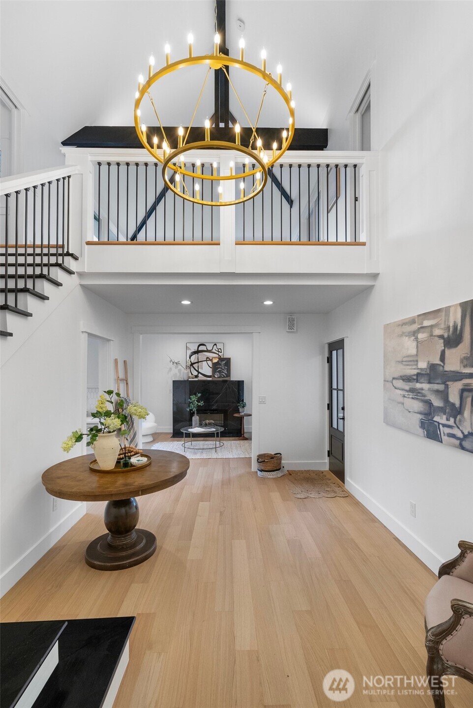 1014 4th Avenue North Seattle, WA 98109 - Photo 6 of 40 a living room with furniture and a chandelier