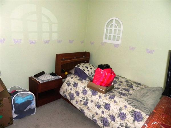 130 8 Briarcliff Road, Unit 1 Raynham, MA 02767 - Photo 11 of 13 a bedroom with a bed and a couch
