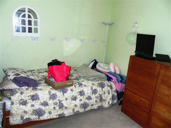 130 8 Briarcliff Road, Unit 1 Raynham, MA 02767 - Photo 12 of 13 a bedroom with a bed and a lamp