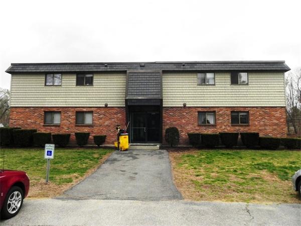 130 8 Briarcliff Road, Unit 1 Raynham, MA 02767 - Photo 2 of 13 a front view of a house with garden