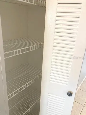 a view of a porch with wooden floor