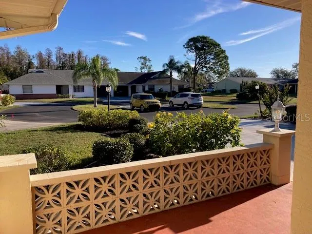 a view of a street with a building in the background