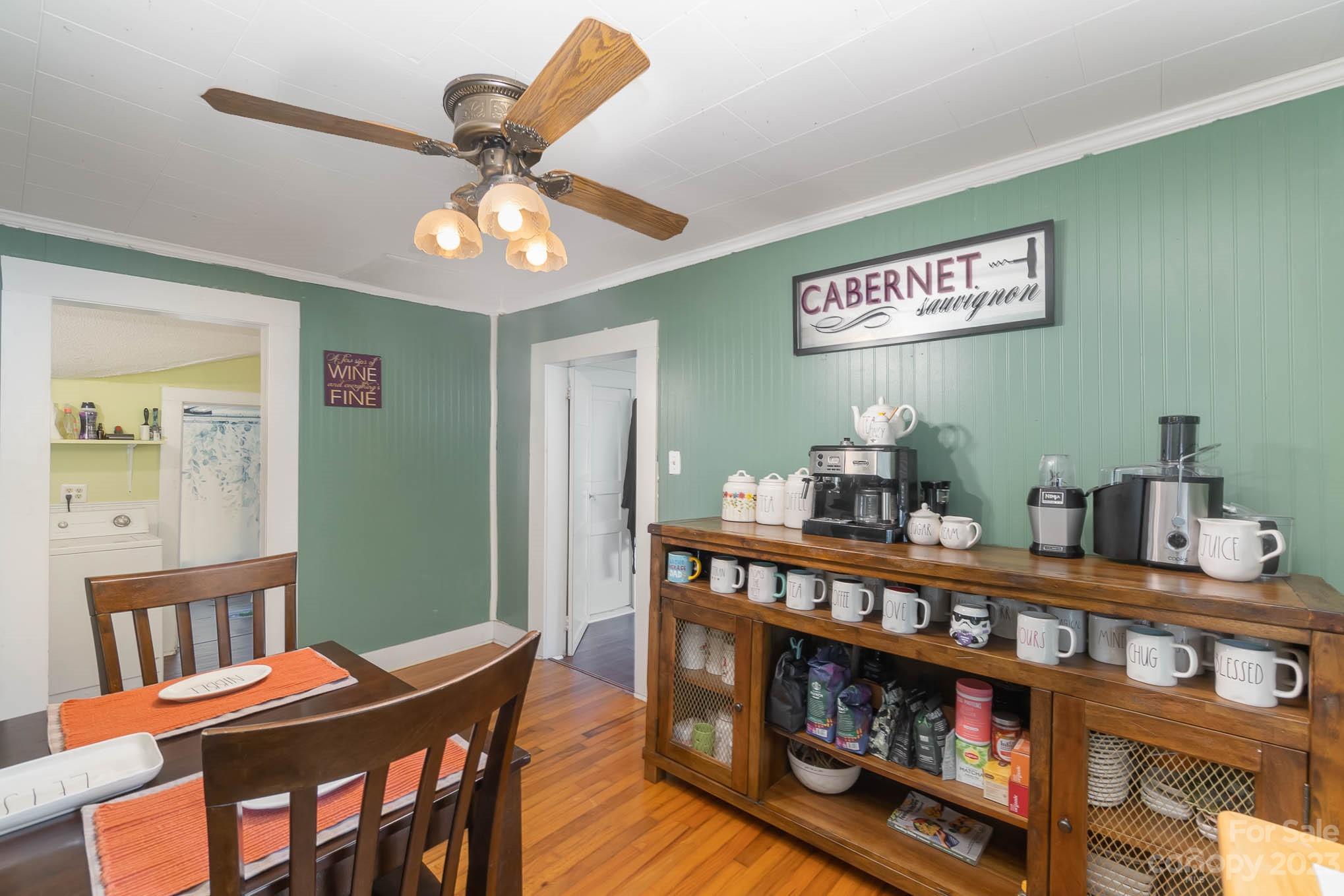 19 Union Street Maiden, NC 28650 - Photo 11 of 29 a living room with furniture a chandelier and a book shelf