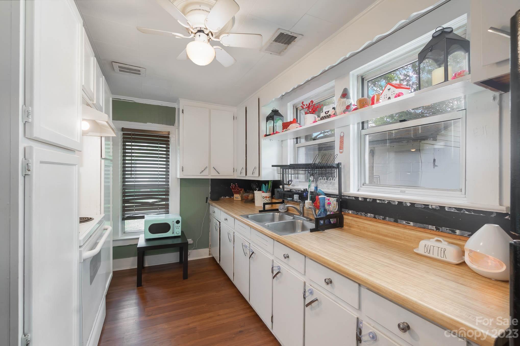19 Union Street Maiden, NC 28650 - Photo 12 of 29 a kitchen with cabinets a sink and appliances