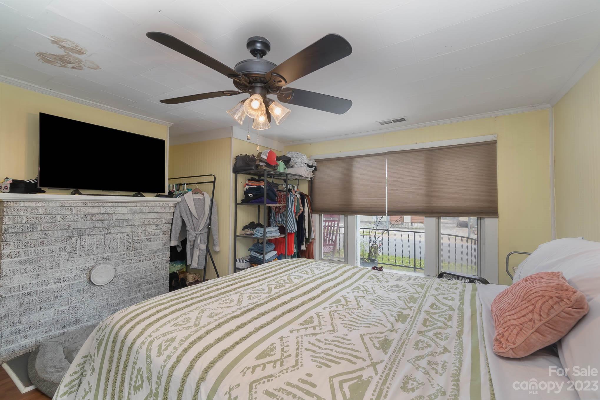 19 Union Street Maiden, NC 28650 - Photo 18 of 29 a bedroom with a bed and a flat screen tv