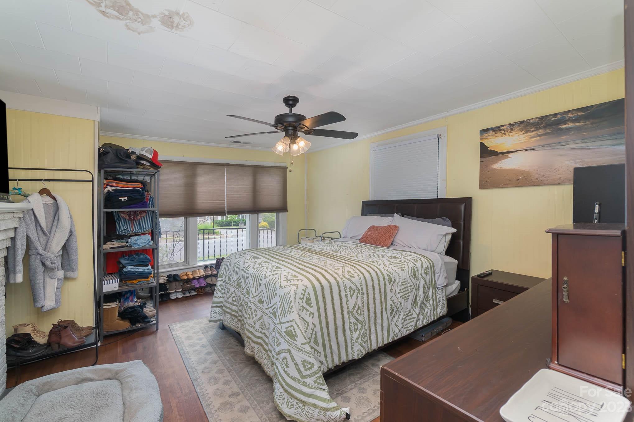 19 Union Street Maiden, NC 28650 - Photo 19 of 29 a bedroom with bed and a chandelier