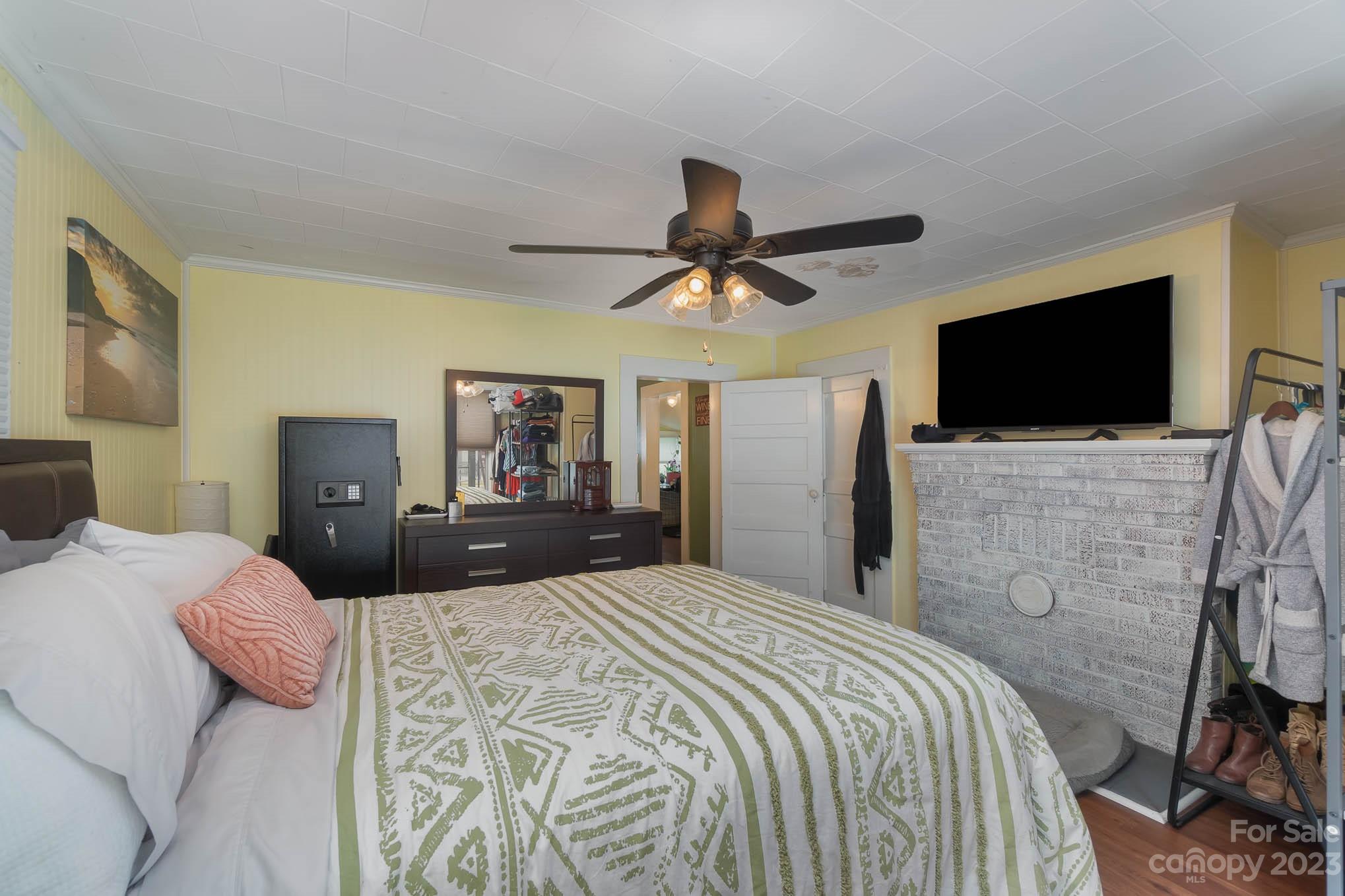 19 Union Street Maiden, NC 28650 - Photo 20 of 29 a bedroom with a bed and a flat screen tv