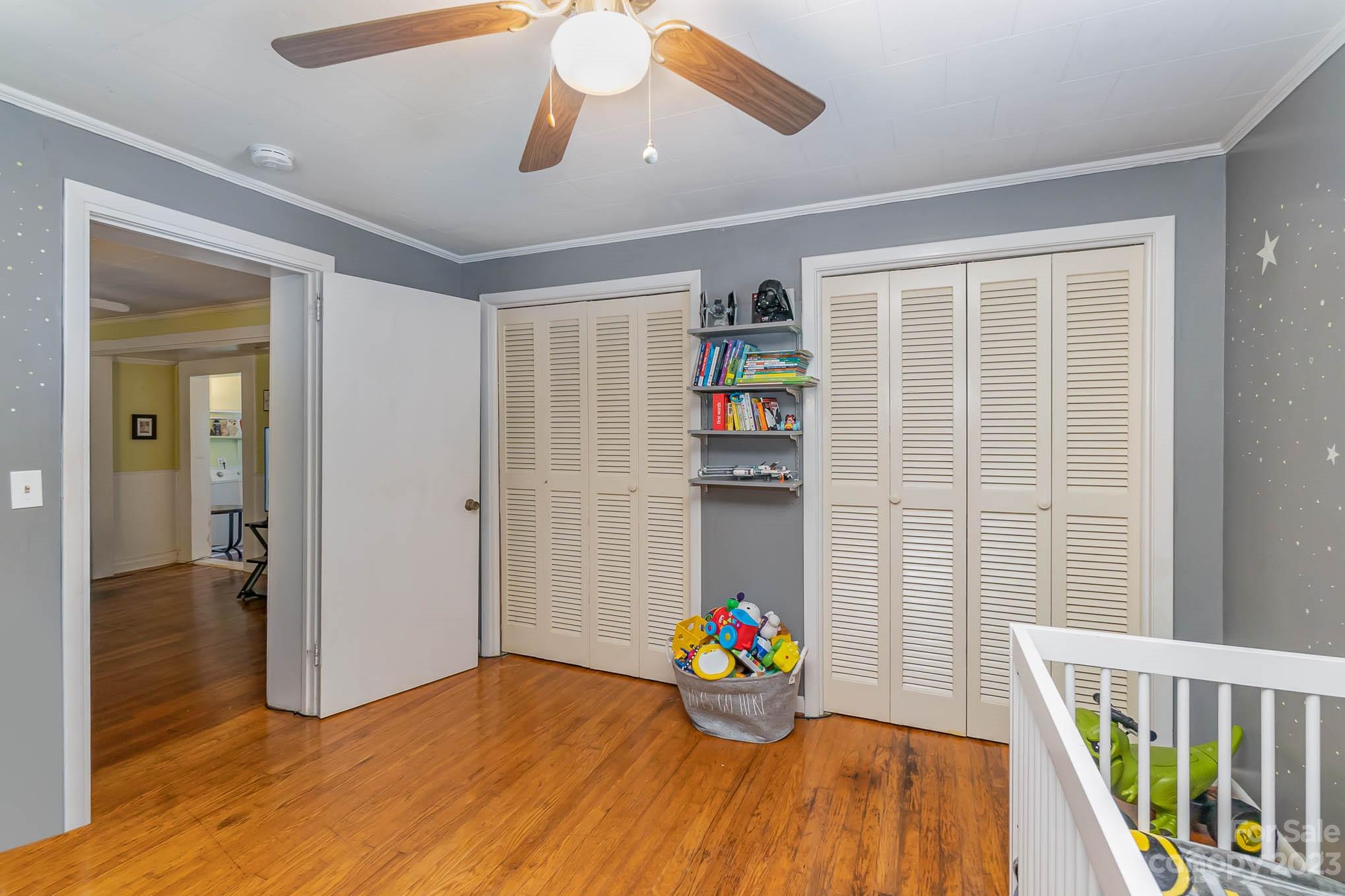 19 Union Street Maiden, NC 28650 - Photo 22 of 29 a view of an empty room with wooden floor and a window