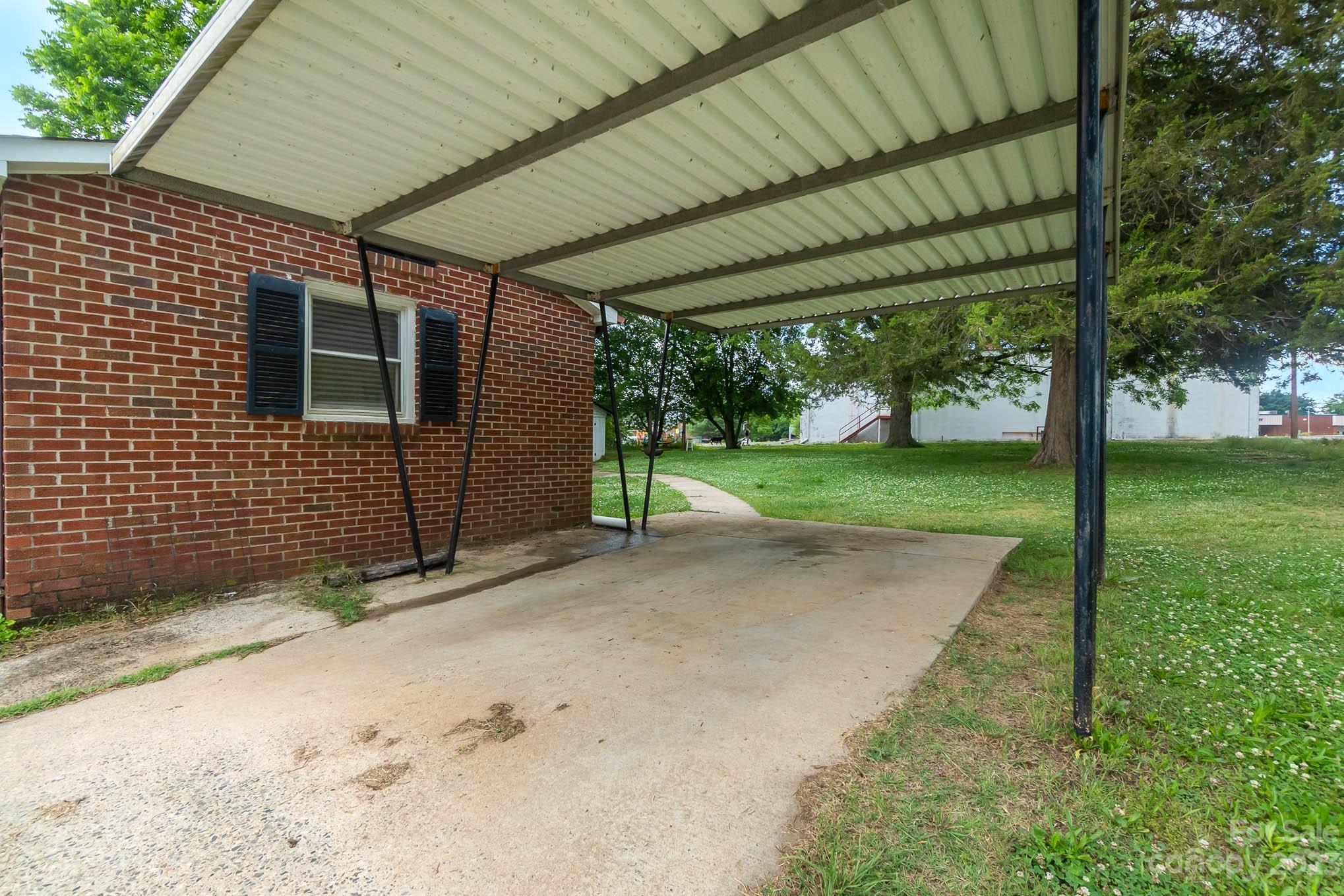19 Union Street Maiden, NC 28650 - Photo 24 of 29 a backyard of a house with a garden and outdoor seating