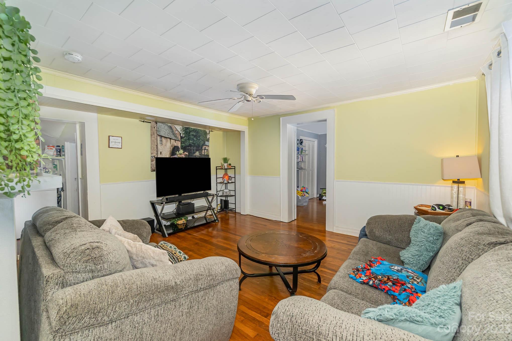 19 Union Street Maiden, NC 28650 - Photo 6 of 29 a living room with furniture and a flat screen tv
