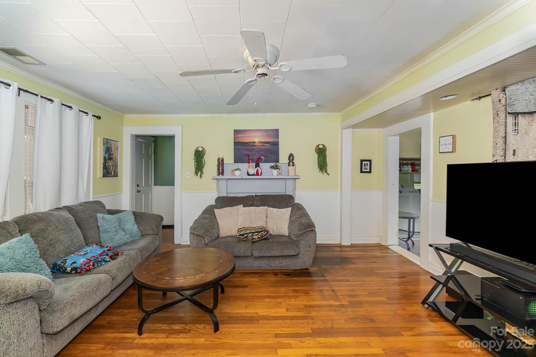 19 Union Street Maiden, NC 28650 - Photo 7 of 29 a living room with furniture and a flat screen tv