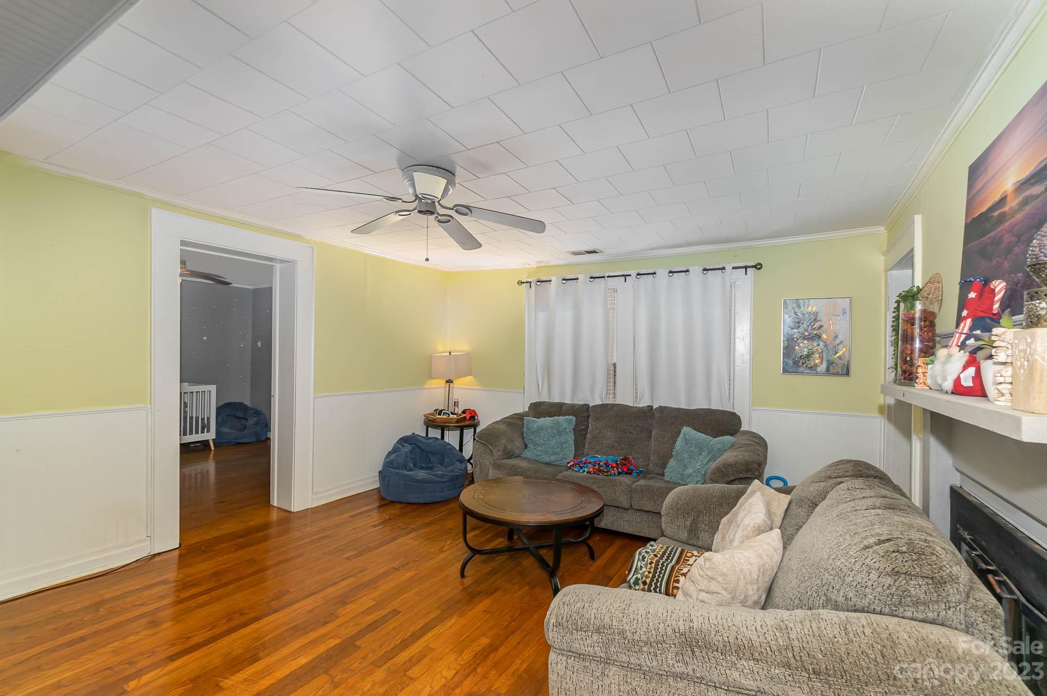 19 Union Street Maiden, NC 28650 - Photo 8 of 29 a living room with furniture and a wooden floor