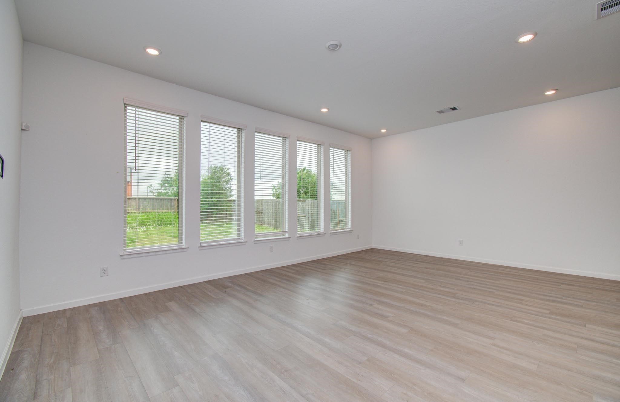 4115 Balboa Drive Iowa Colony, TX 77583 - Photo 5 of 9 a view of an empty room with wooden floor and a window