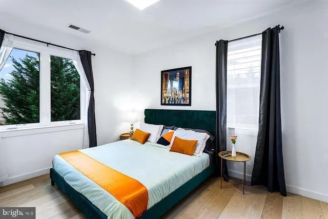 a bedroom with a bed and window