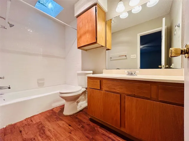 a bathroom with a sink a toilet and bathtub