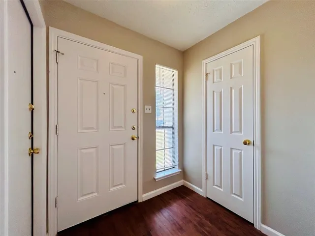 a view of a livingroom with wooden floor