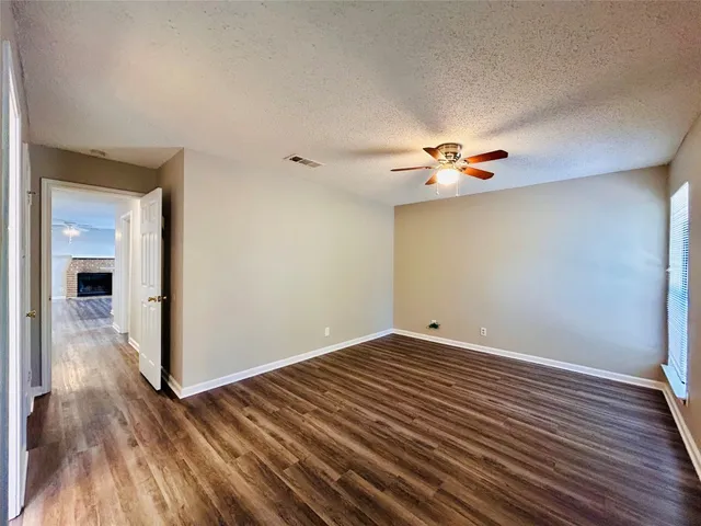 a bathroom with a toilet and a mirror