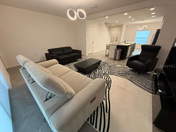 a living room with furniture and a couch