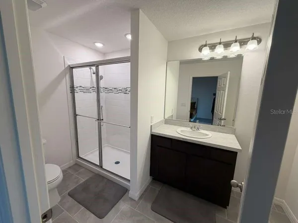 a view of a hallway with staircase