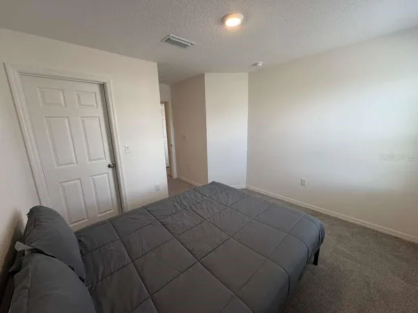 a large bed sitting in a room