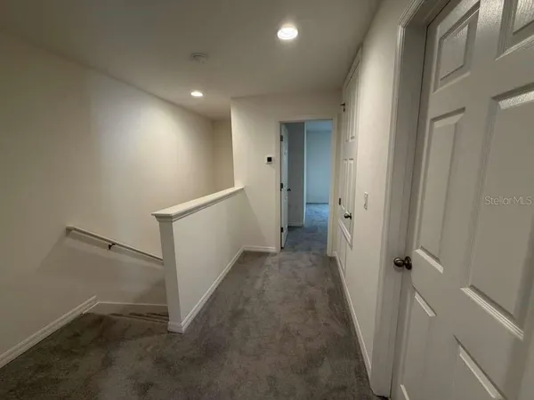 a bedroom with a bed and pillows